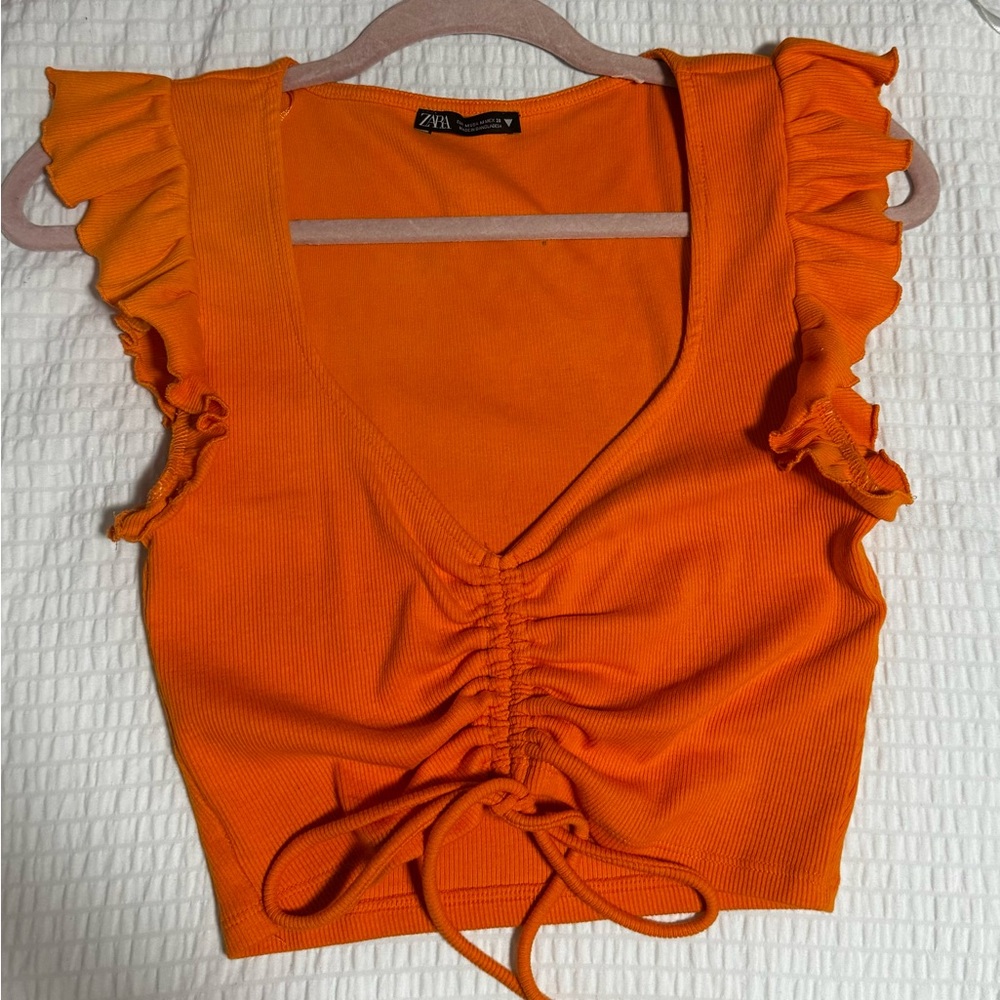 Orange ruffle top